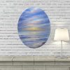 Winter Sunrise seascape painting above fireplace